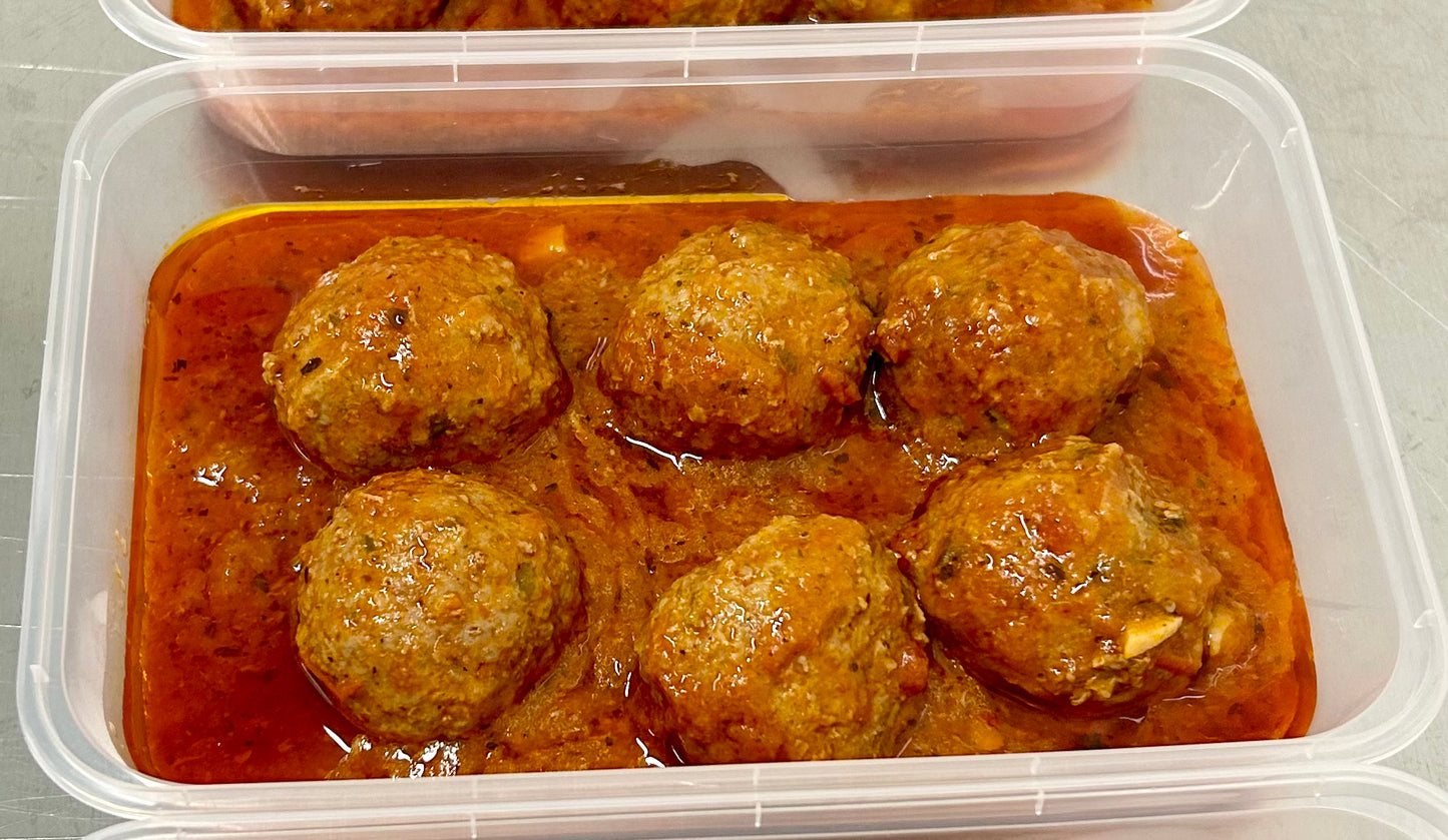 Meatballs cooked in tomato sauce